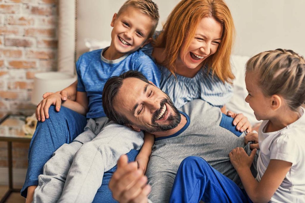 Stages of Addiction Recovery, family sitting together laughing
