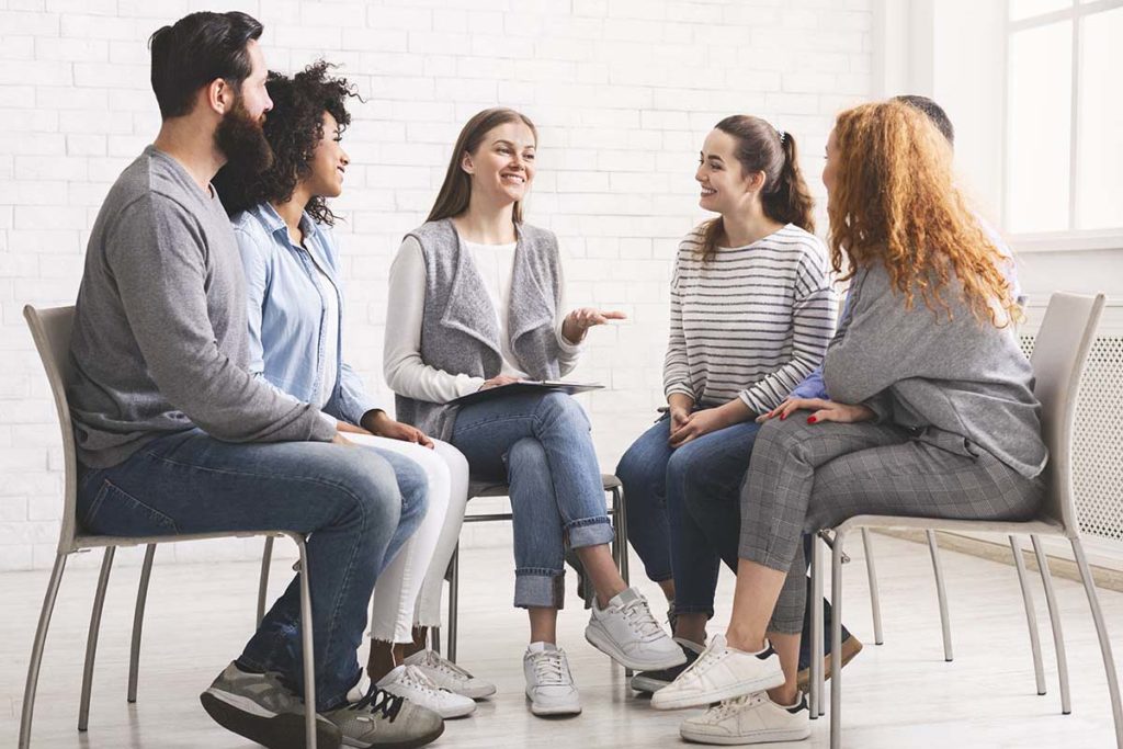 Types of Addiction, group of people sitting in therapy circle