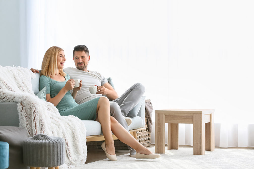 couple on couch showing Quarantined with an Alcoholic Spouse