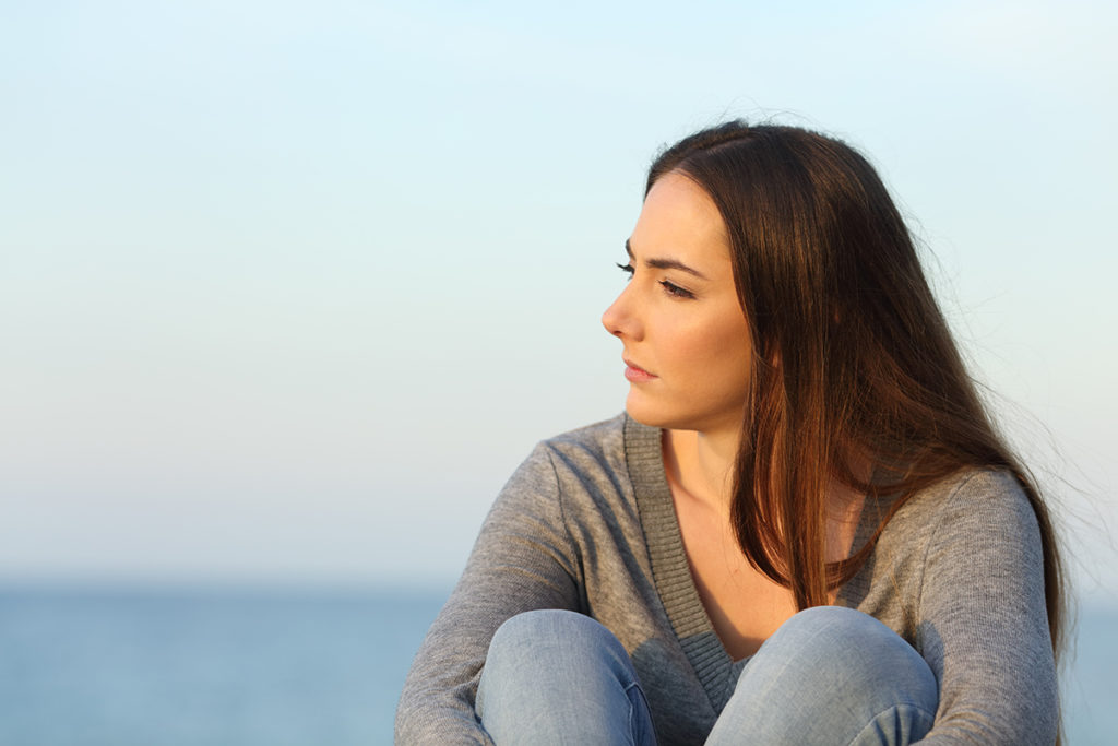 woman looking out over sea dealing with benzos and alcohol