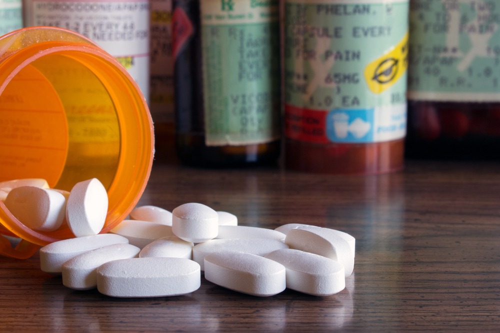 White pills on a table for someone with Opioid dependence