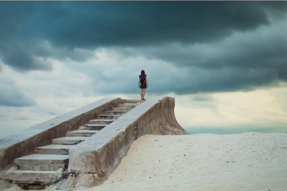 Woman on steps represents 12-step treatment approach