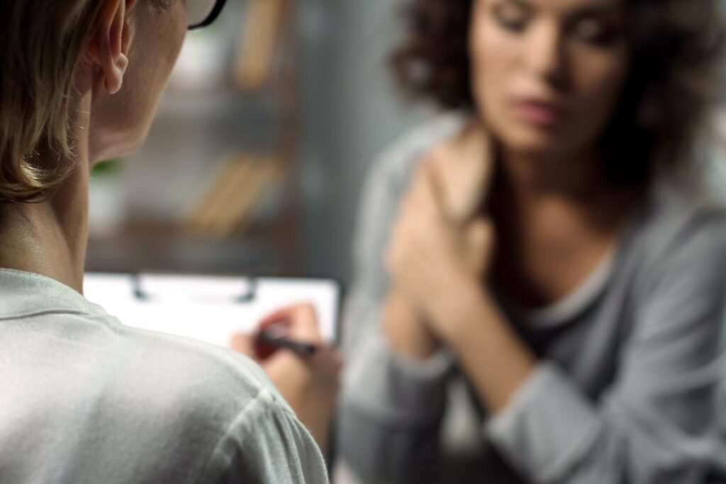 woman discussing with therapist what co-occurring disorders are