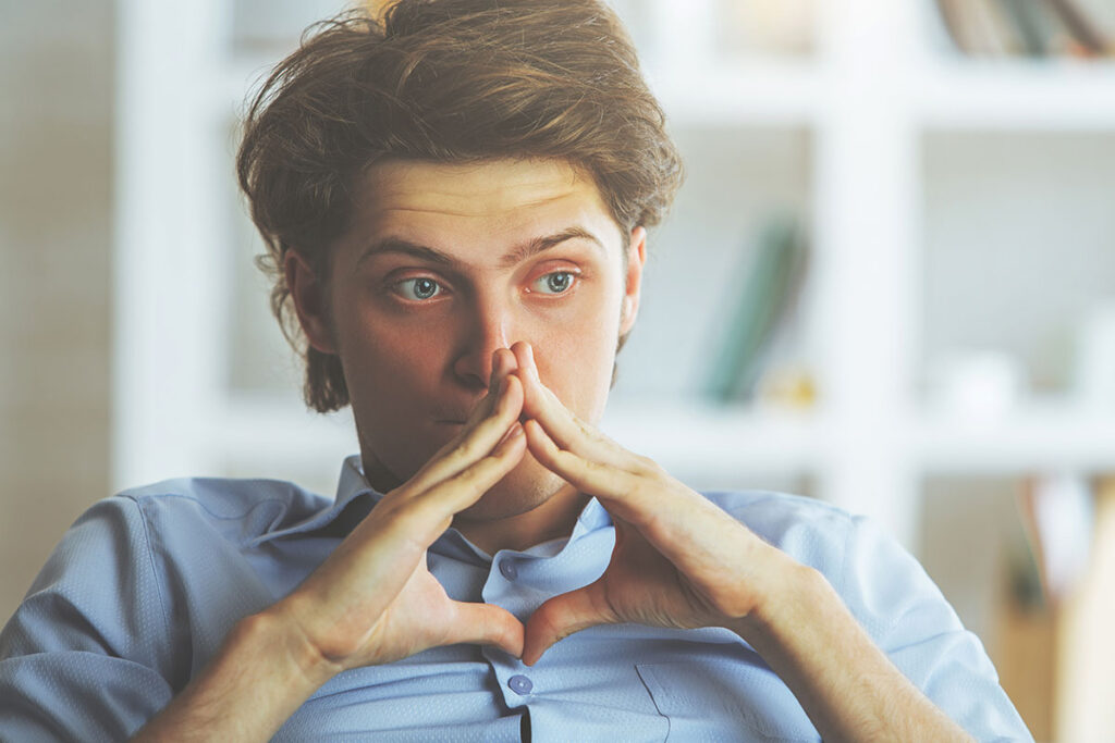 worried young man wondering when will prescription pain medicine become a problem