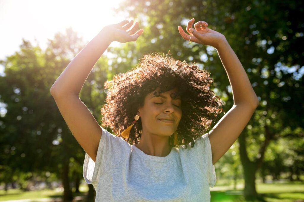 Woman celebrating reaching her goal of getting sober by springtime