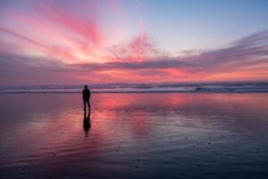 Person enjoying a beautiful view outdoors and thinking of drug and alcohol detox