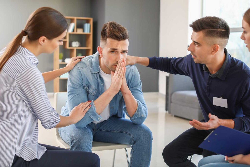 Three people in therapy talking about moral inventory and recovery