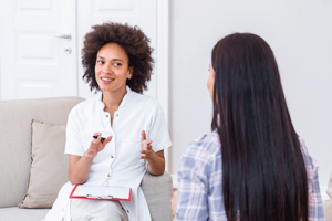 Two people talking at an alcohol detox center