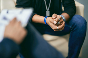 Hands of people in dual diagnosis treatment