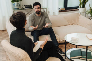 Two people talking at a cognitive-behavioral therapy session