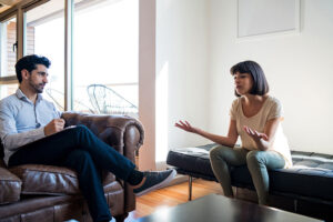 Two people talking at an individual therapy program session