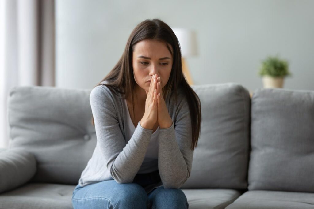 Person struggling with abusing painkillers and alcohol