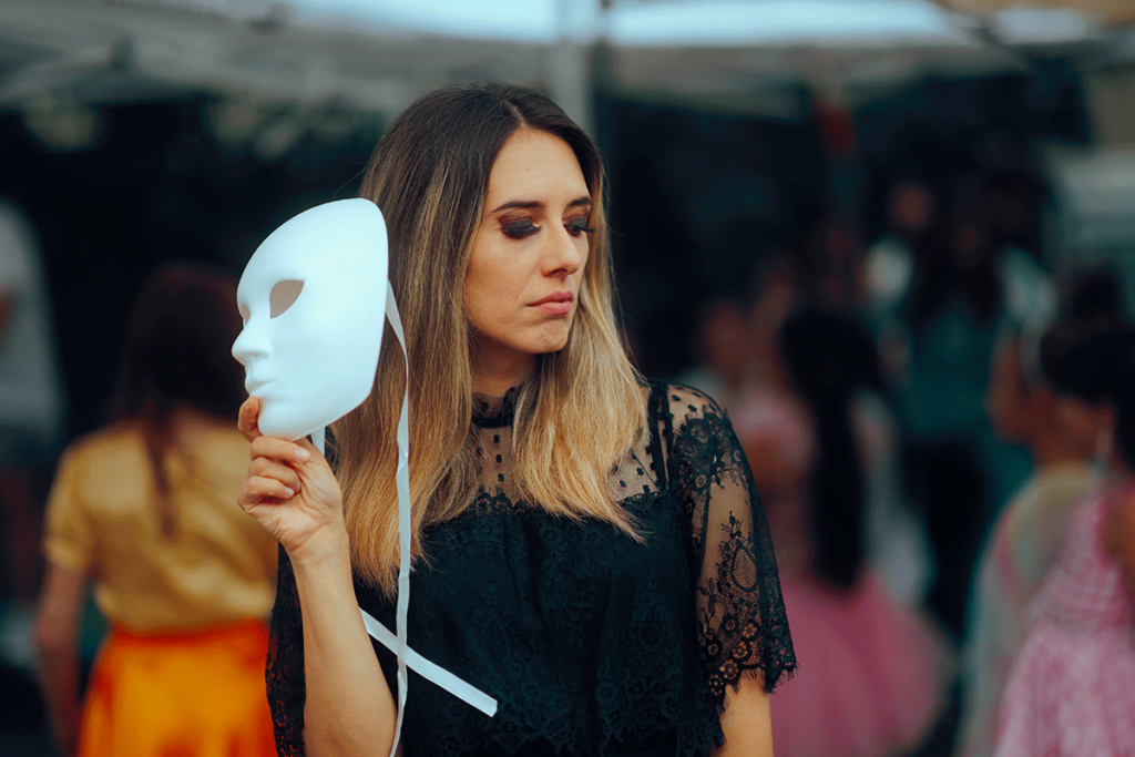 Person with mask thinking about social anxiety and drinking