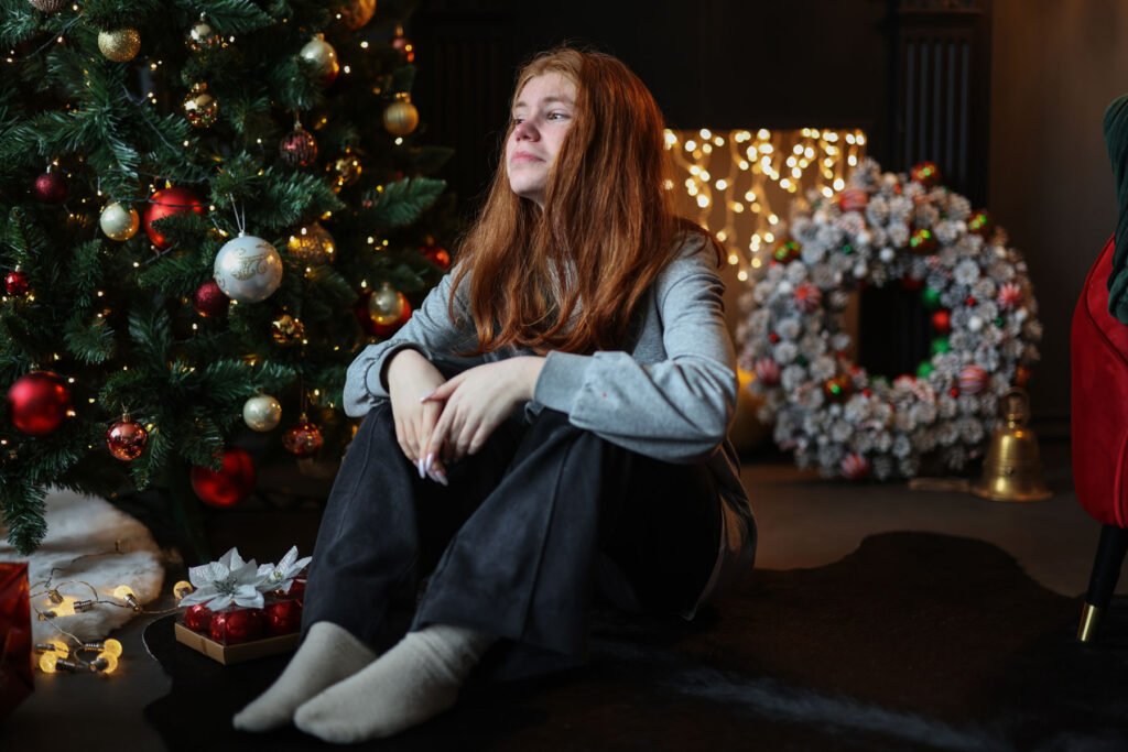 Person managing addiction triggers during the holidays
