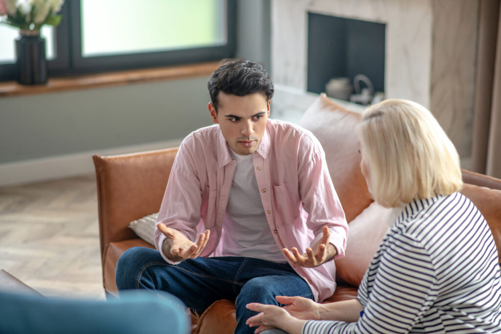 Person talking to their therapist about cognitive-behavioral therapy for depression